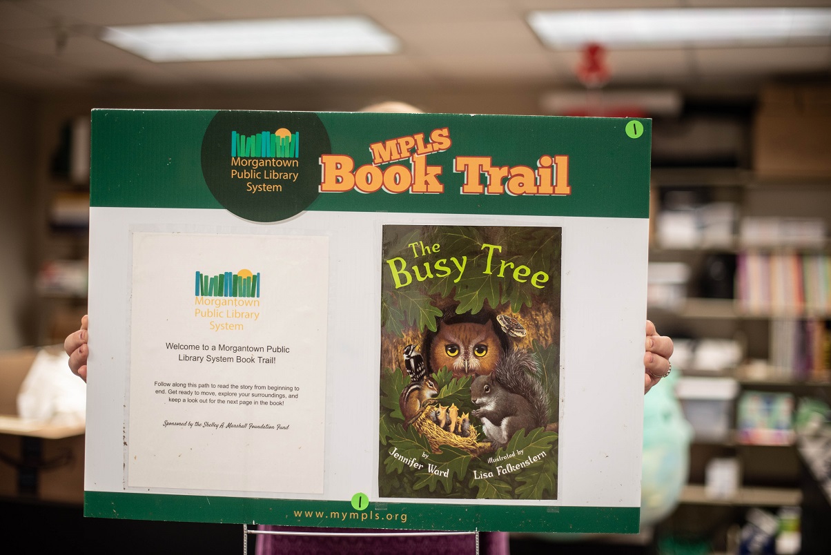 Image of a book trail poster with the first page of the book "The Busy Tree"