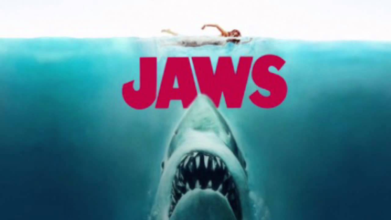 Jaws movie poster featuring a giant shark coming up underneath a swimmer