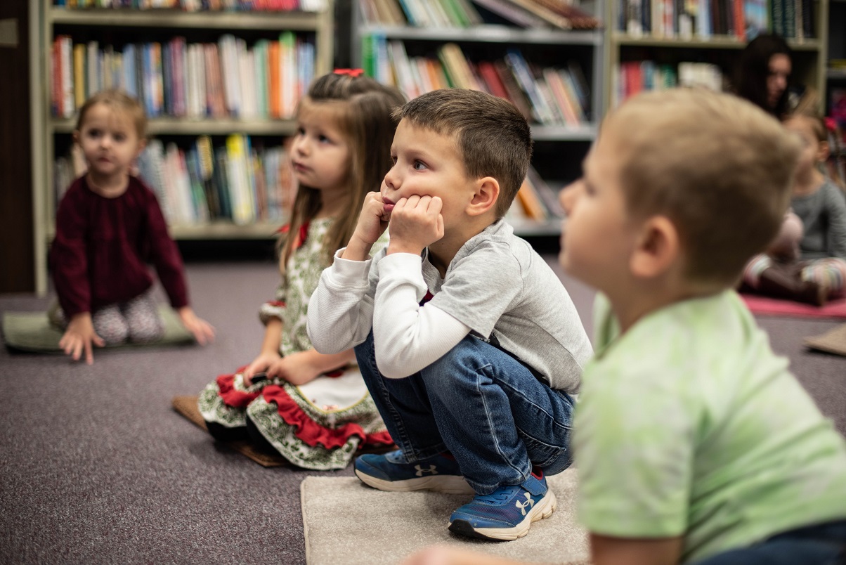 Children listening to a story during story time.